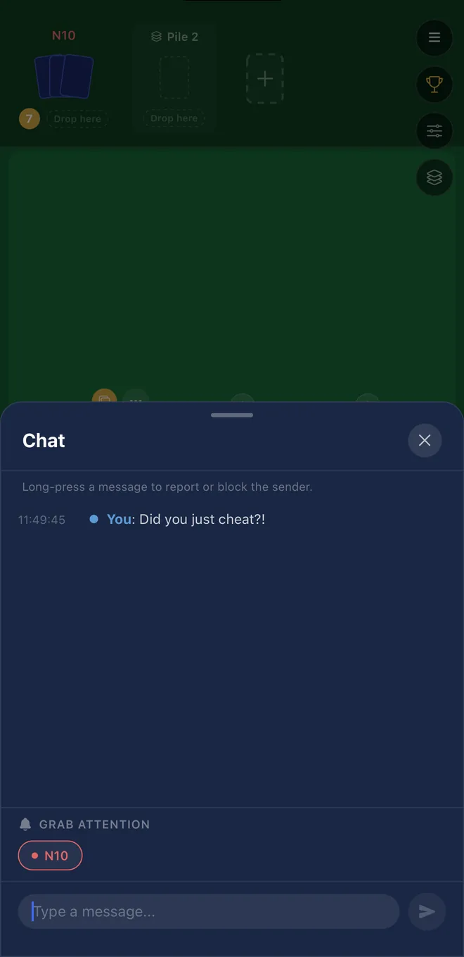 The in-game chat panel open over a card table.